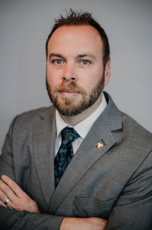 Headshot of Adam Cliffe
