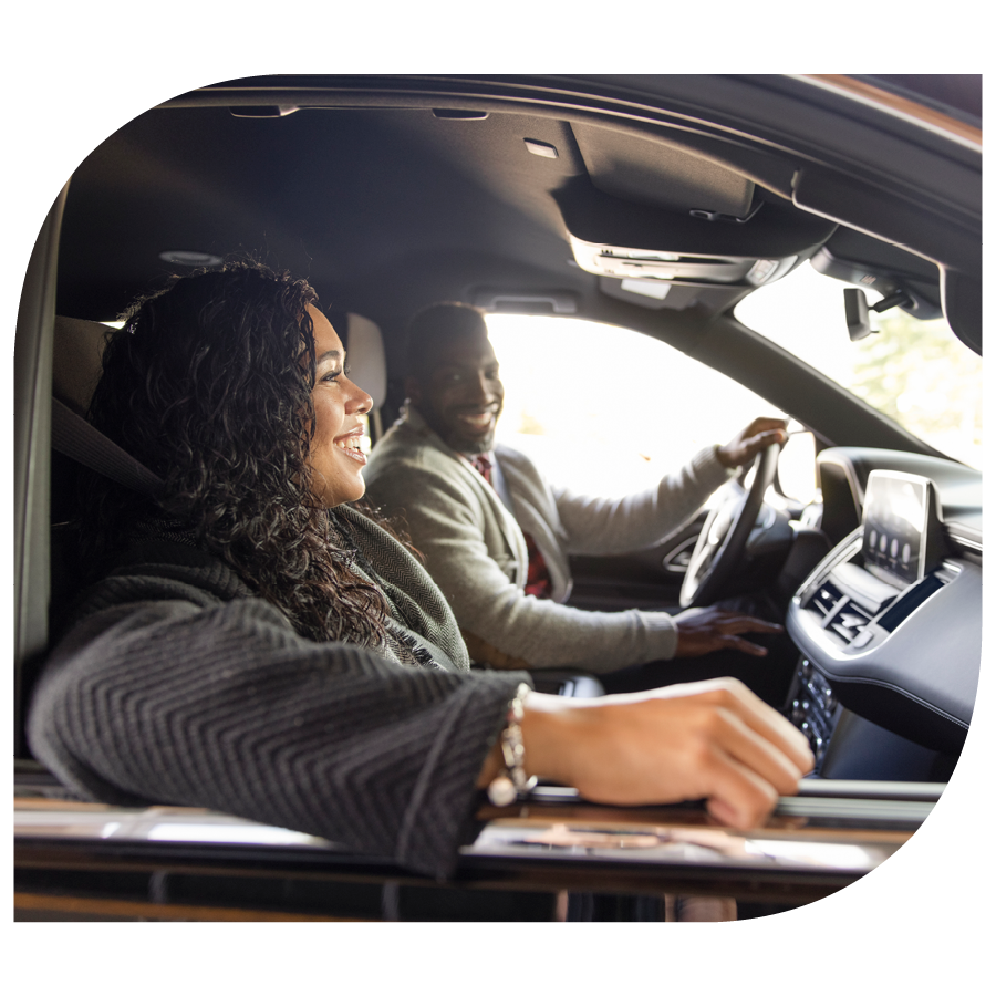 woman and man riding in new car