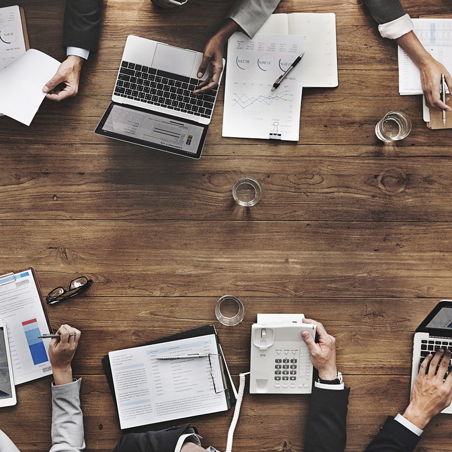 Aerial view of people sitting at a conference table