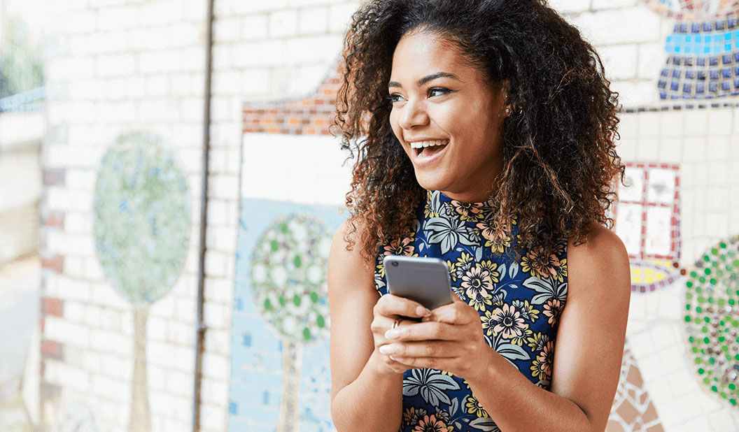 Young woman looking at her phone