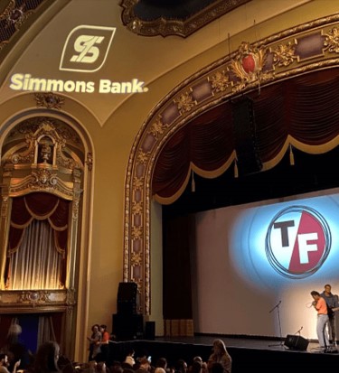 simmons bank logo projected on wall at True/False Film Fest