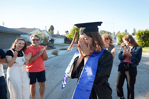 Graduate surrounded by family